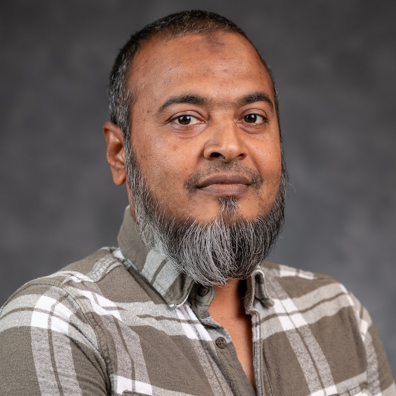 Man with beard and shaved head smiling